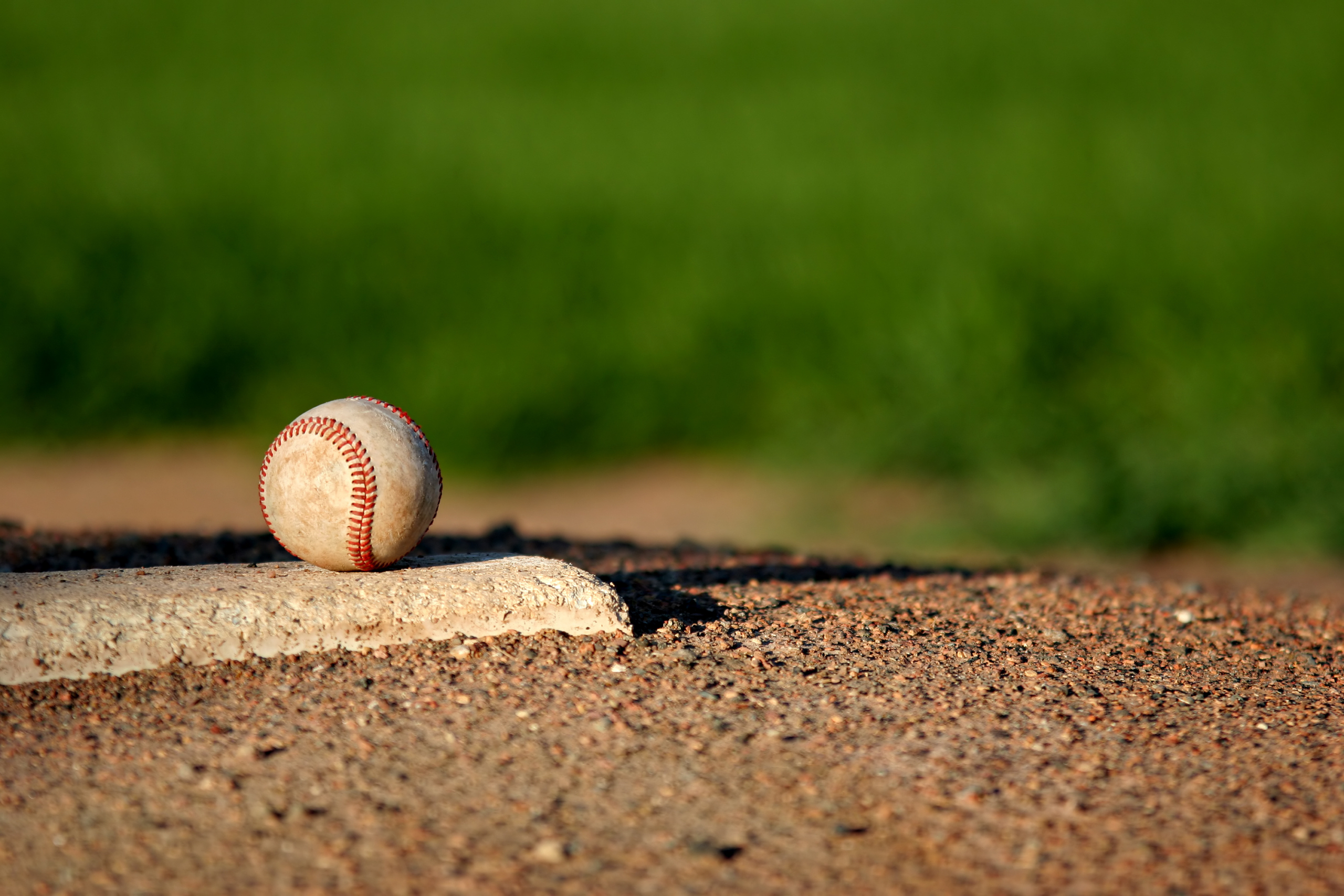 Close-up of a baseball on the pitcher's mound.